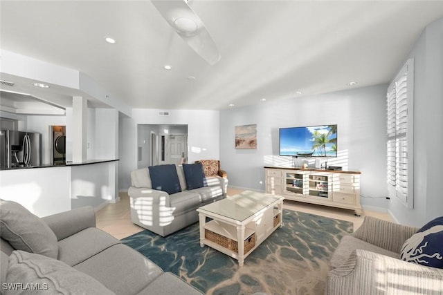 tiled living room with baseboards, visible vents, and recessed lighting