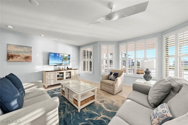 living room with recessed lighting and baseboards