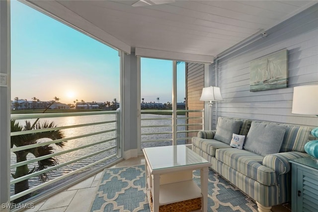 balcony featuring outdoor lounge area and a water view