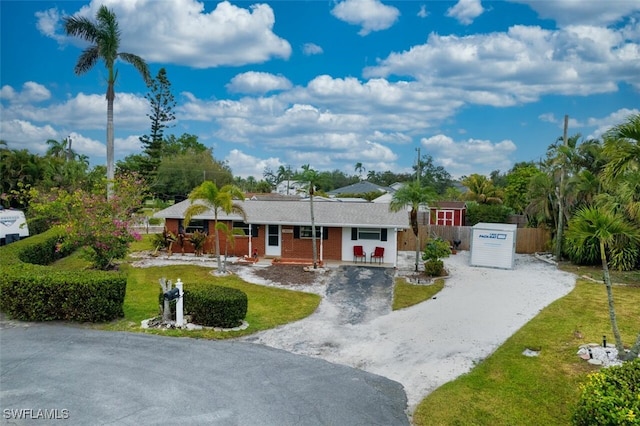 ranch-style house featuring a front lawn