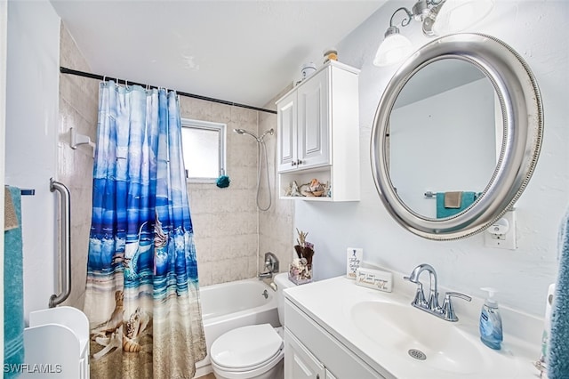 full bath with toilet, vanity, and shower / bath combo with shower curtain