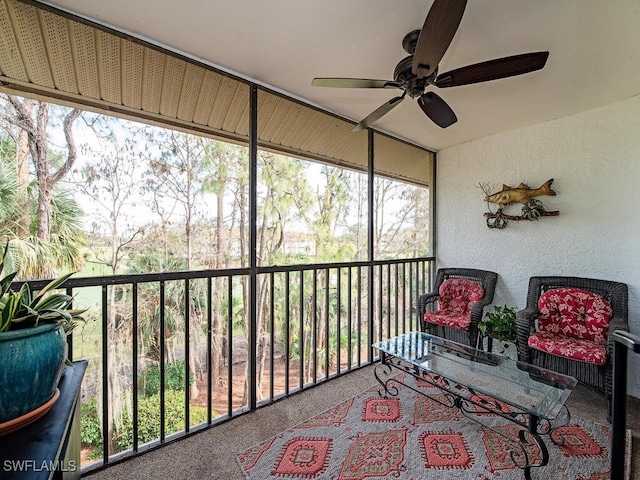 sunroom with a ceiling fan