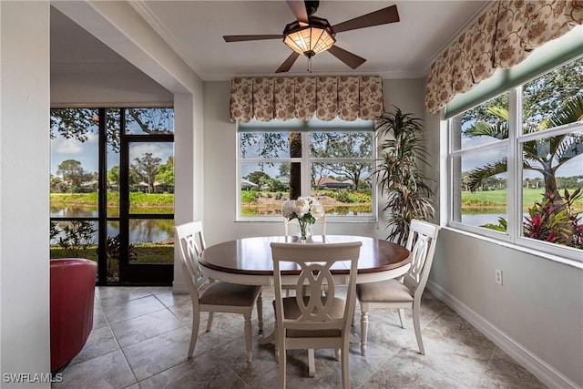 sunroom with a water view and a healthy amount of sunlight