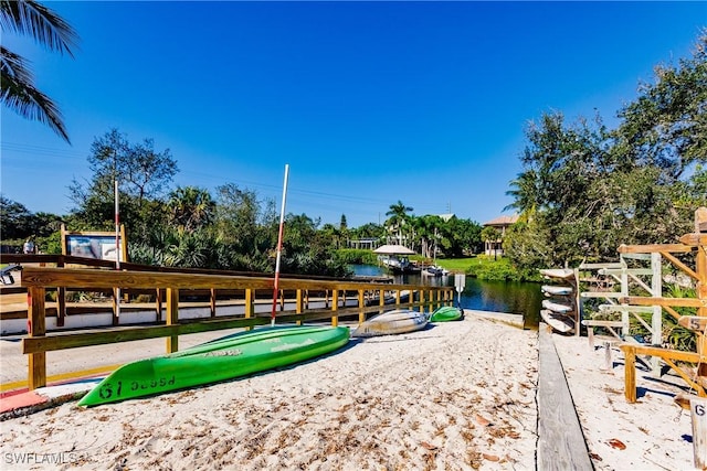surrounding community with a water view