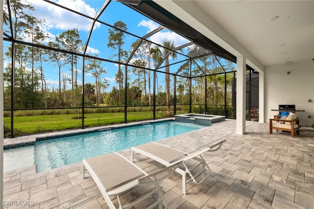 view of swimming pool with a patio, a lanai, and a pool with connected hot tub