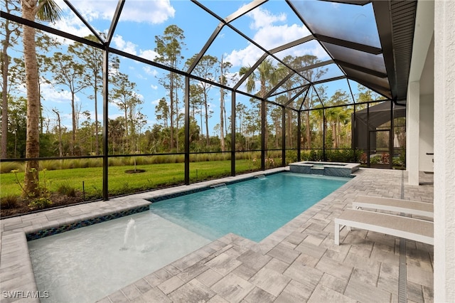 view of swimming pool featuring a lanai, a patio area, and a pool with connected hot tub