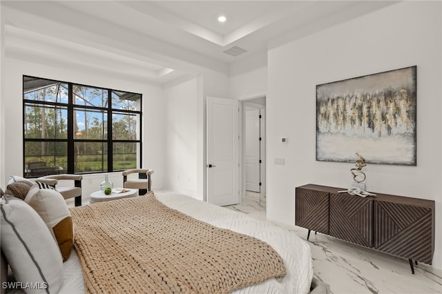 bedroom with marble finish floor, visible vents, a tray ceiling, and recessed lighting