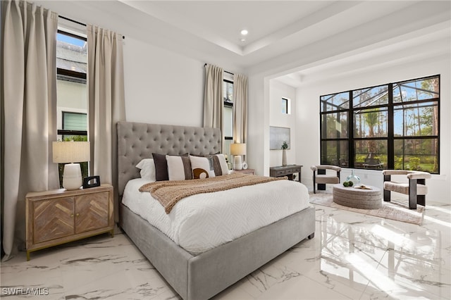 bedroom featuring marble finish floor, multiple windows, and recessed lighting