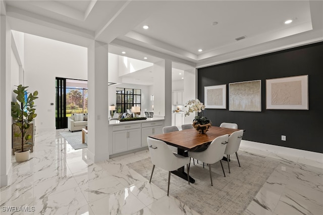 dining room featuring marble finish floor, a raised ceiling, visible vents, and recessed lighting