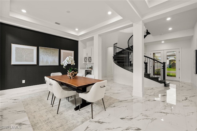 dining space with a raised ceiling, stairway, marble finish floor, french doors, and recessed lighting