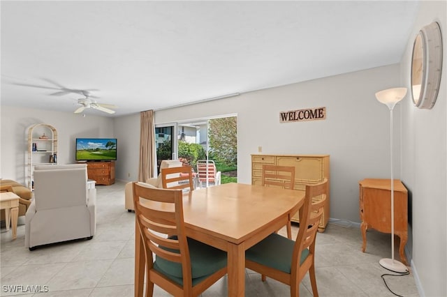 dining area featuring light tile patterned floors and ceiling fan