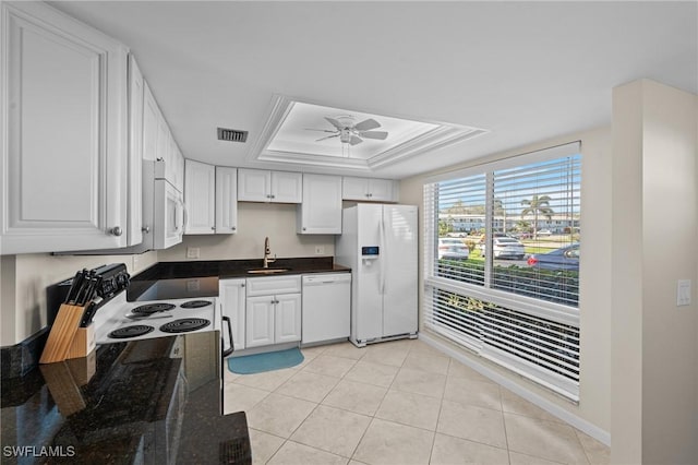 kitchen with white cabinetry, sink, white appliances, and a raised ceiling