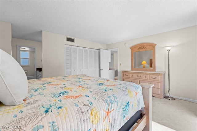 bedroom featuring a closet and a textured ceiling