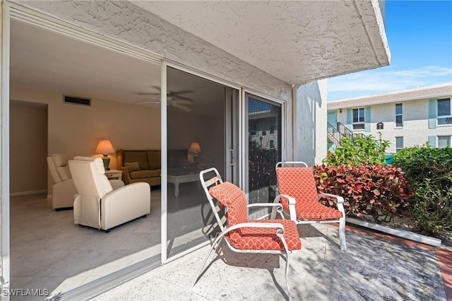 view of patio with ceiling fan