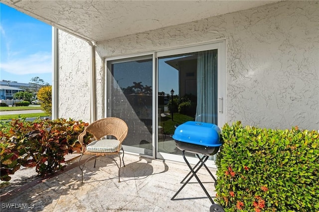 view of patio featuring a grill