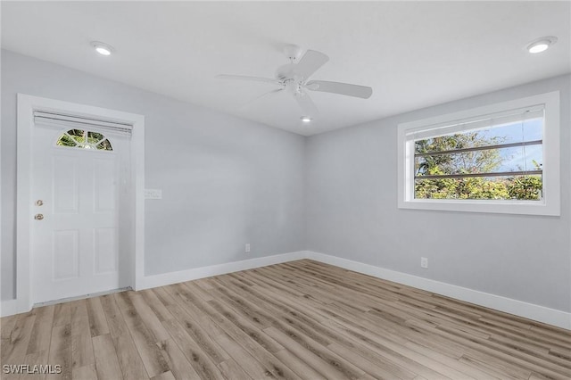 spare room featuring a ceiling fan, light wood-type flooring, baseboards, and recessed lighting