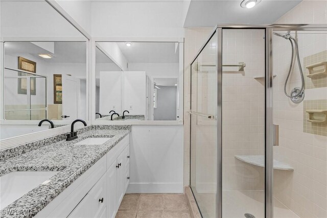 14819 Randolph Ct, Fort Myers, FL 33905 - full bath with double vanity, a shower stall, and tile patterned floors
