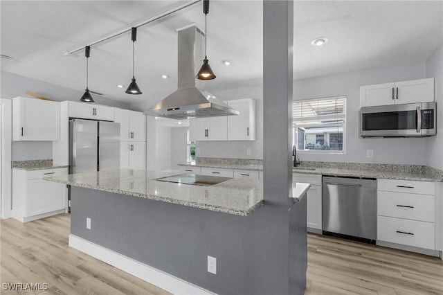 kitchen featuring a center island, light wood finished floors, appliances with stainless steel finishes, white cabinetry, and island range hood