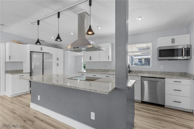 14819 Randolph Ct, Fort Myers, FL 33905 - kitchen featuring appliances with stainless steel finishes, island exhaust hood, healthy amount of natural light, white cabinets, and recessed lighting