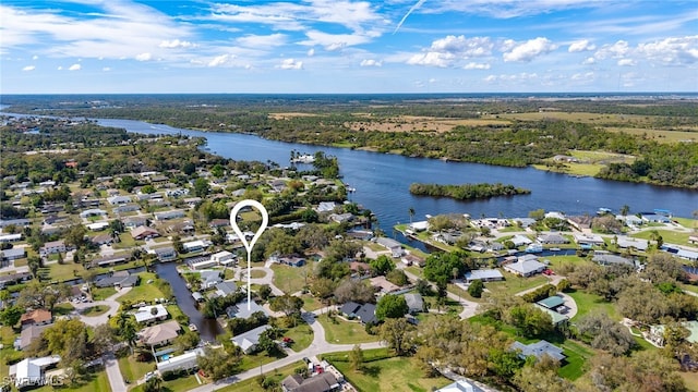 drone / aerial view with a water view and a residential view