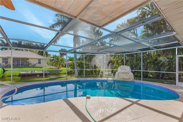 outdoor pool featuring a patio area and a lanai