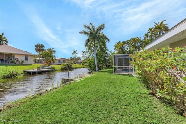 view of yard featuring a water view and a lanai