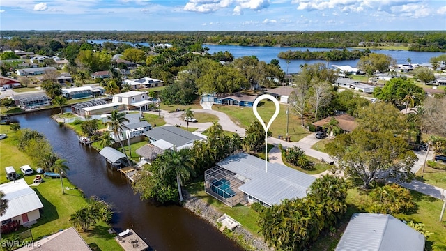 bird's eye view with a water view and a residential view