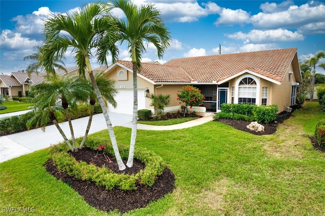 16380 Kelly Woods Dr, Fort Myers, FL 33908 - view of front of property with a garage and a front yard