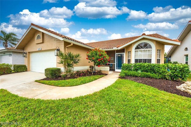16380 Kelly Woods Dr, Fort Myers, FL 33908 - view of front of home featuring a garage and a front yard