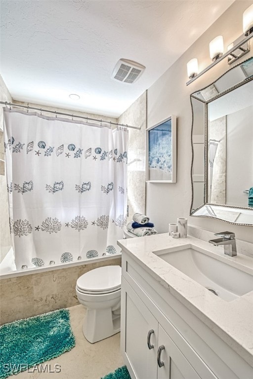 16380 Kelly Woods Dr, Fort Myers, FL 33908 - full bathroom with vanity, toilet, shower / tub combo, and a textured ceiling