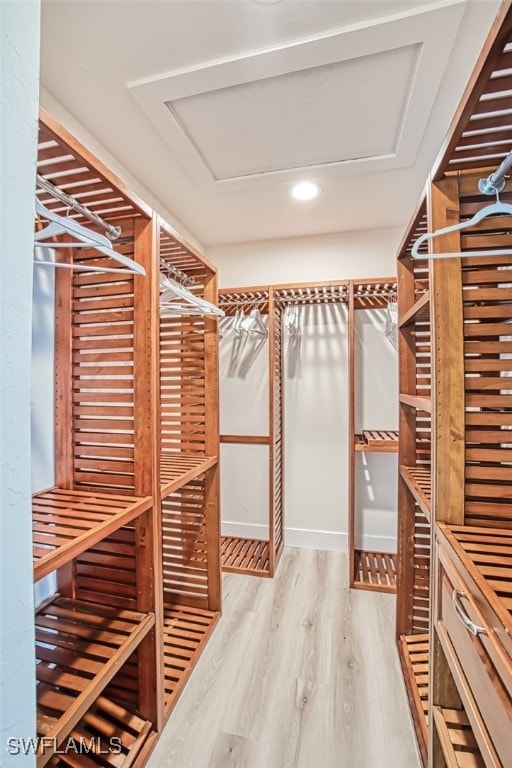 16380 Kelly Woods Dr, Fort Myers, FL 33908 - walk in closet featuring wood-type flooring
