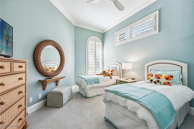 bedroom featuring ceiling fan, ornamental molding, and carpet floors