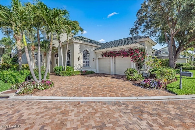 mediterranean / spanish-style home featuring a garage