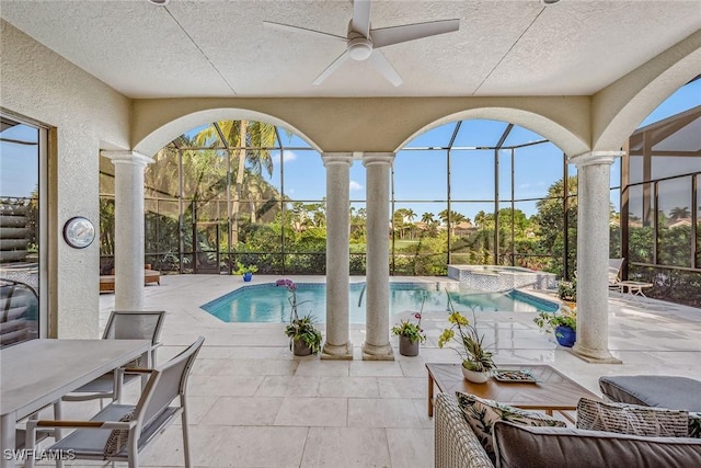 view of swimming pool featuring a patio area, glass enclosure, ceiling fan, and an in ground hot tub