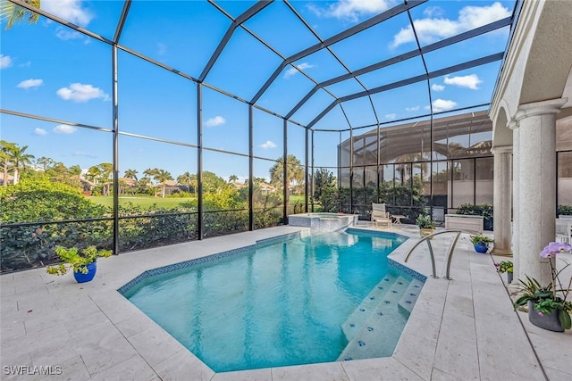 view of swimming pool featuring an in ground hot tub, a lanai, and a patio area