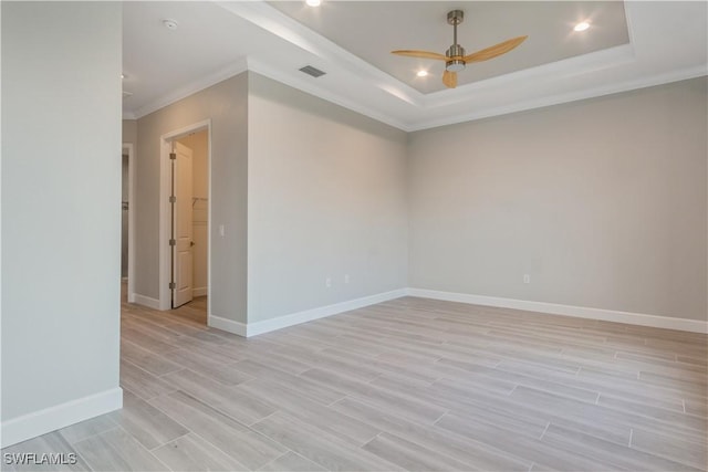 4320 Vasco St, Punta Gorda, FL 33950 - unfurnished room featuring visible vents, baseboards, a ceiling fan, wood tiled floor, and a tray ceiling