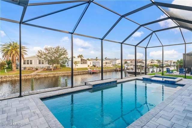 4320 Vasco St, Punta Gorda, FL 33950 - view of swimming pool with a water view, glass enclosure, a patio area, and a residential view