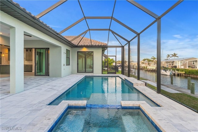 4320 Vasco St, Punta Gorda, FL 33950 - view of pool featuring a patio area, a lanai, a water view, and a pool with connected hot tub