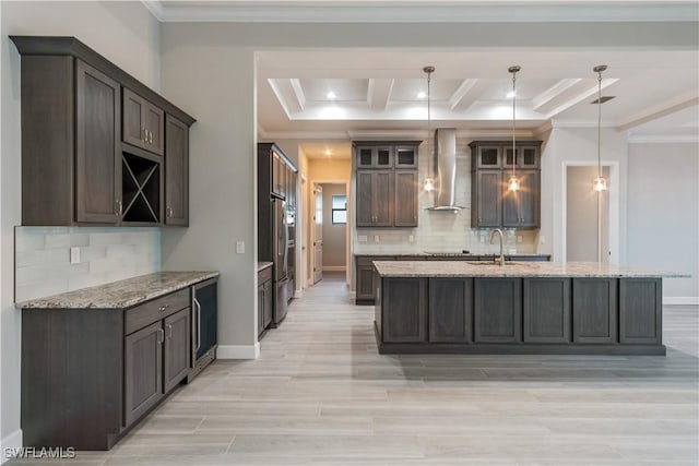 4320 Vasco St, Punta Gorda, FL 33950 - kitchen with glass insert cabinets, pendant lighting, wall chimney exhaust hood, and light stone countertops