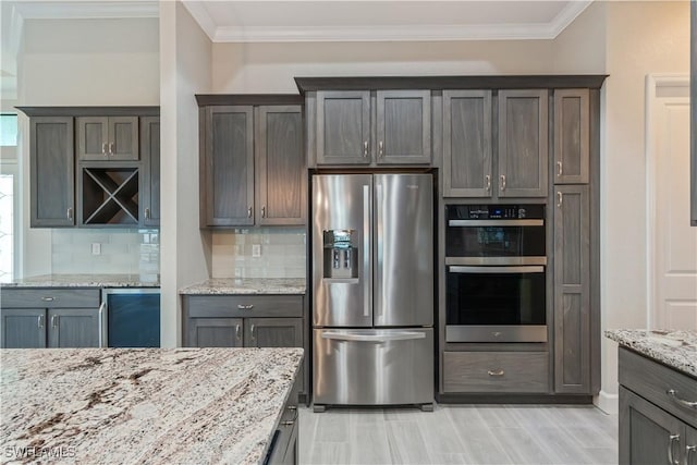 4320 Vasco St, Punta Gorda, FL 33950 - kitchen with light stone countertops, stainless steel fridge, double oven, and crown molding