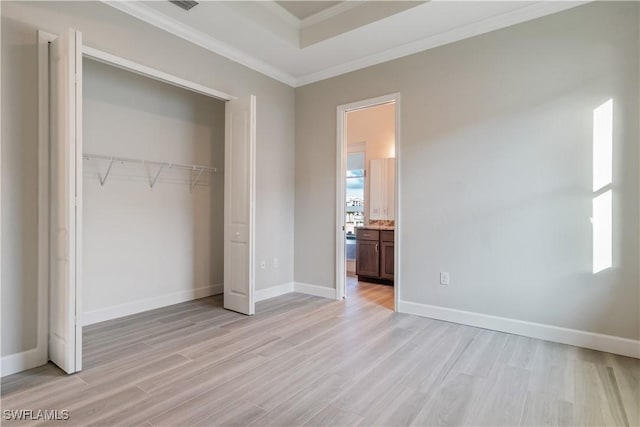 4320 Vasco St, Punta Gorda, FL 33950 - unfurnished bedroom featuring ornamental molding, a closet, light wood-type flooring, and baseboards