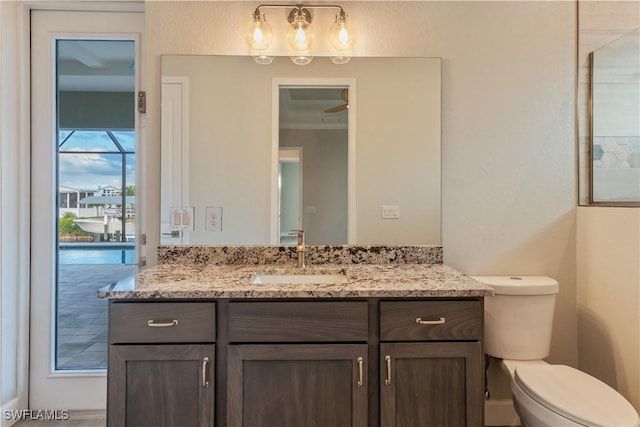 4320 Vasco St, Punta Gorda, FL 33950 - bathroom with toilet, ornamental molding, and vanity