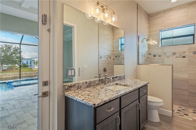 4320 Vasco St, Punta Gorda, FL 33950 - bathroom with toilet, walk in shower, and vanity