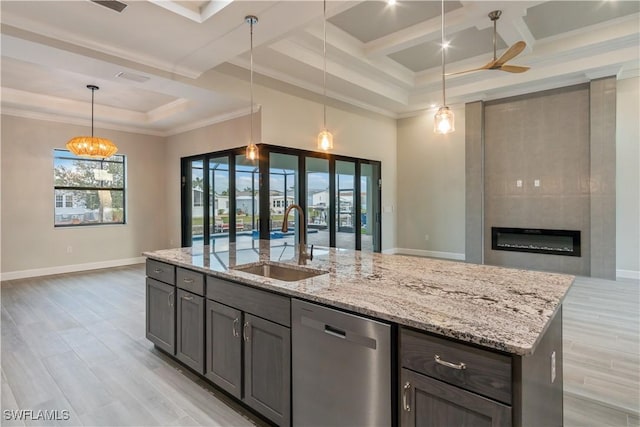 4320 Vasco St, Punta Gorda, FL 33950 - kitchen featuring open floor plan, dishwasher, a sink, and light stone countertops