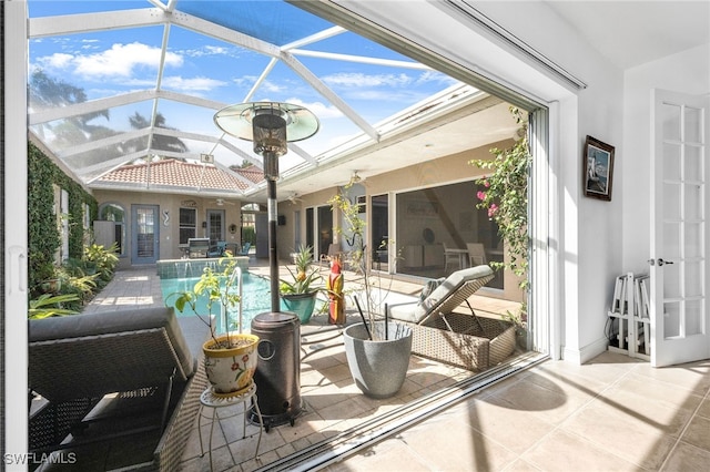 sunroom featuring lofted ceiling