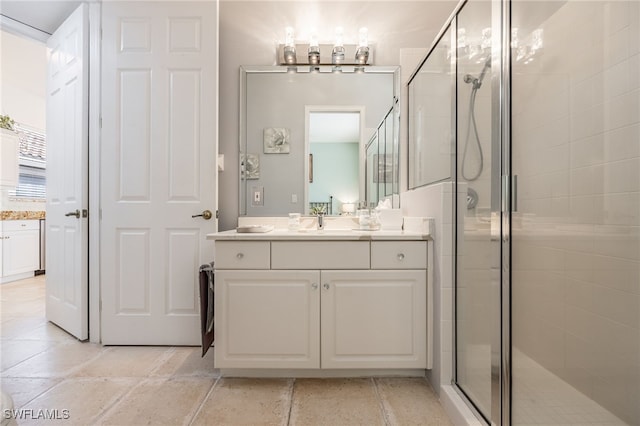 full bathroom with a shower stall and vanity