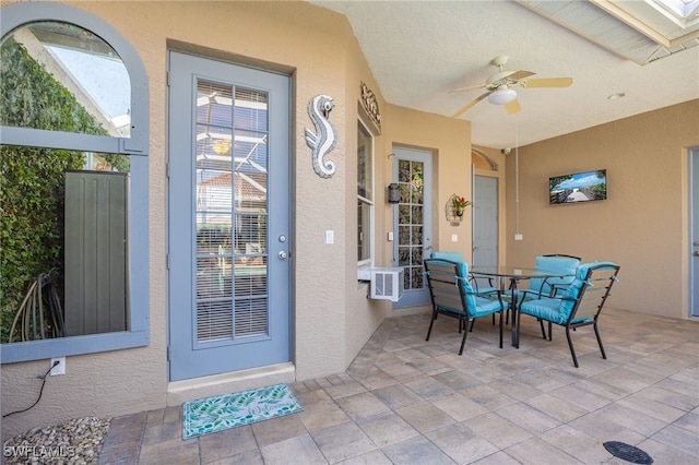 view of patio with ceiling fan and outdoor dining area