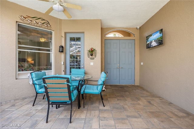 view of patio / terrace featuring a ceiling fan