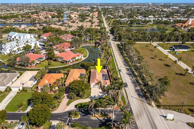 aerial view with a water view and a residential view