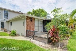 view of property exterior with a yard